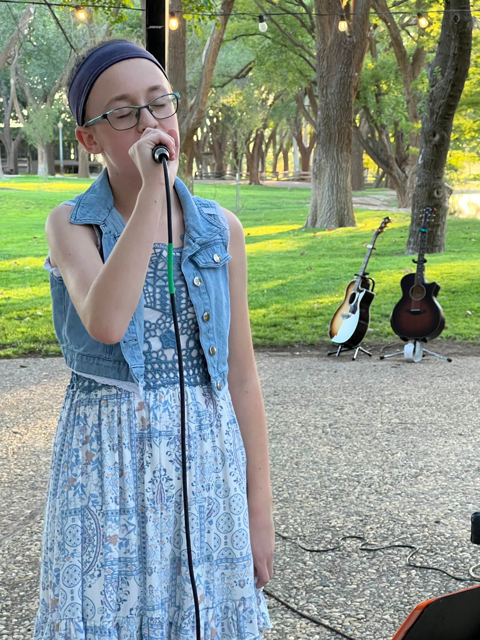 A student performing at an outdoor recital