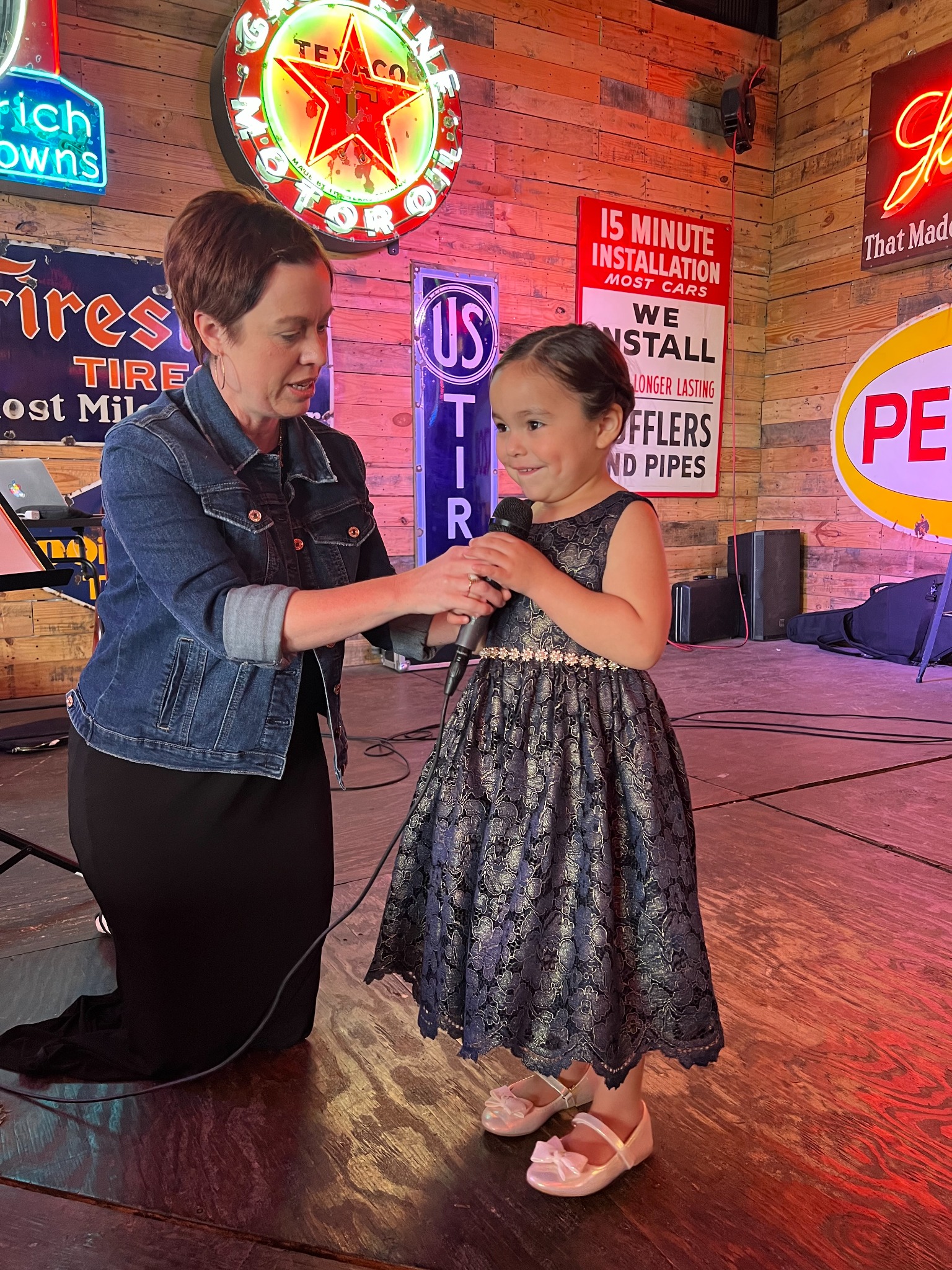 Amber supporting a young student at a recital